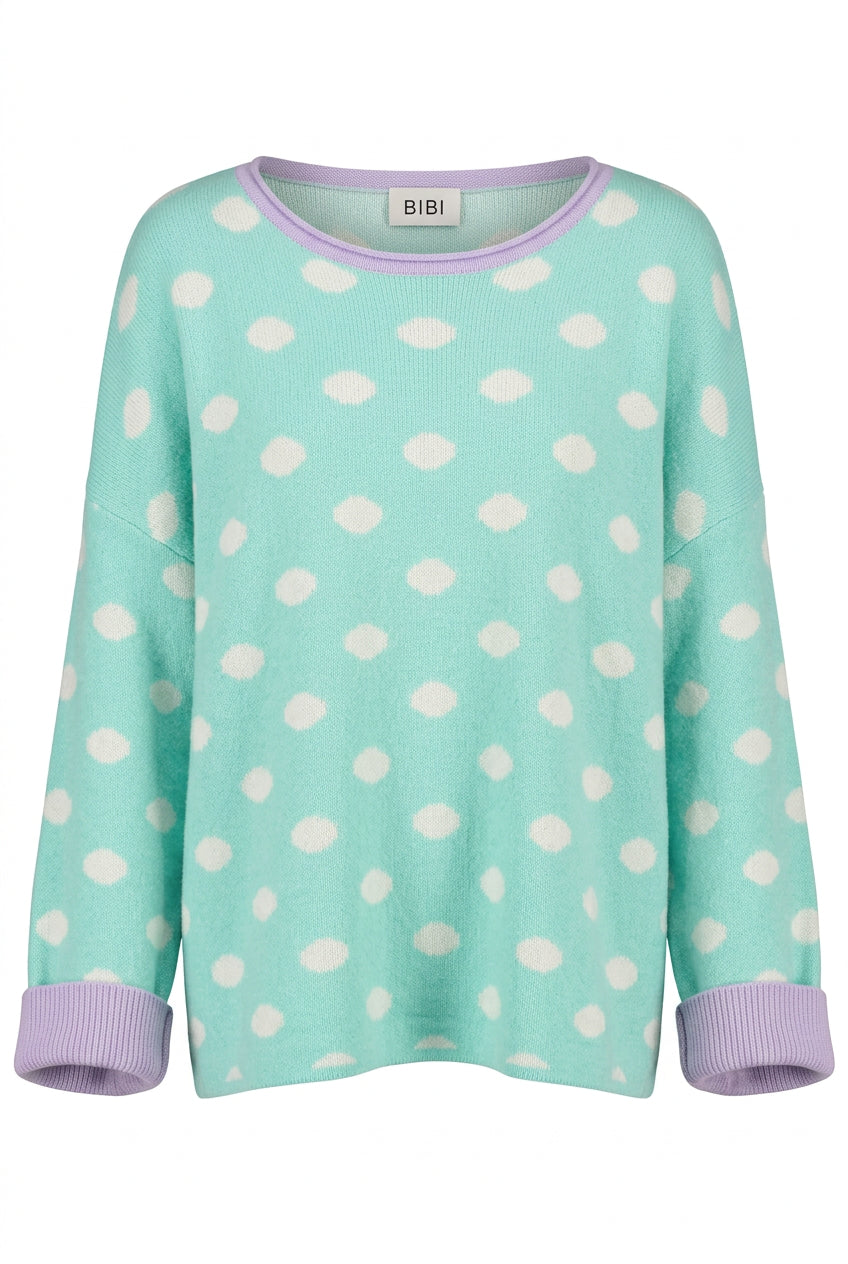 Trestles Clothing Company mint green knit sweater with white polka dots, lavender crew neck, and ribbed cuffs.